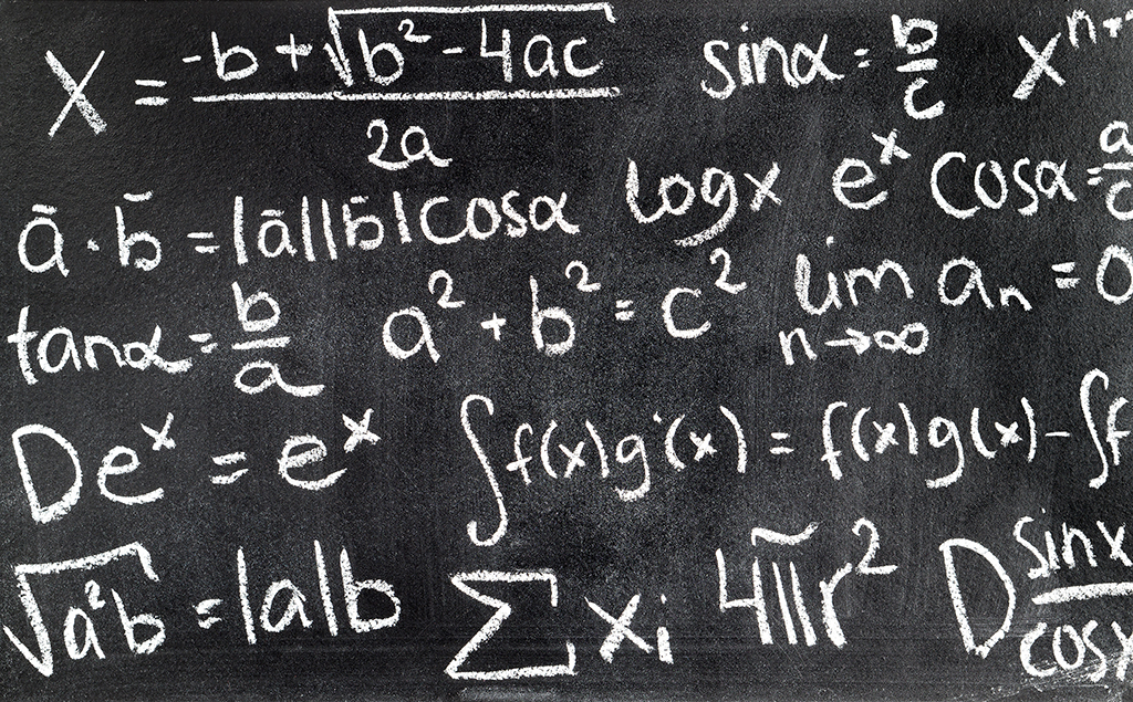 Handwritten mathematical formulas on blackboard written with chalk. Chalkboard full of theory and calculations. Math equation background.